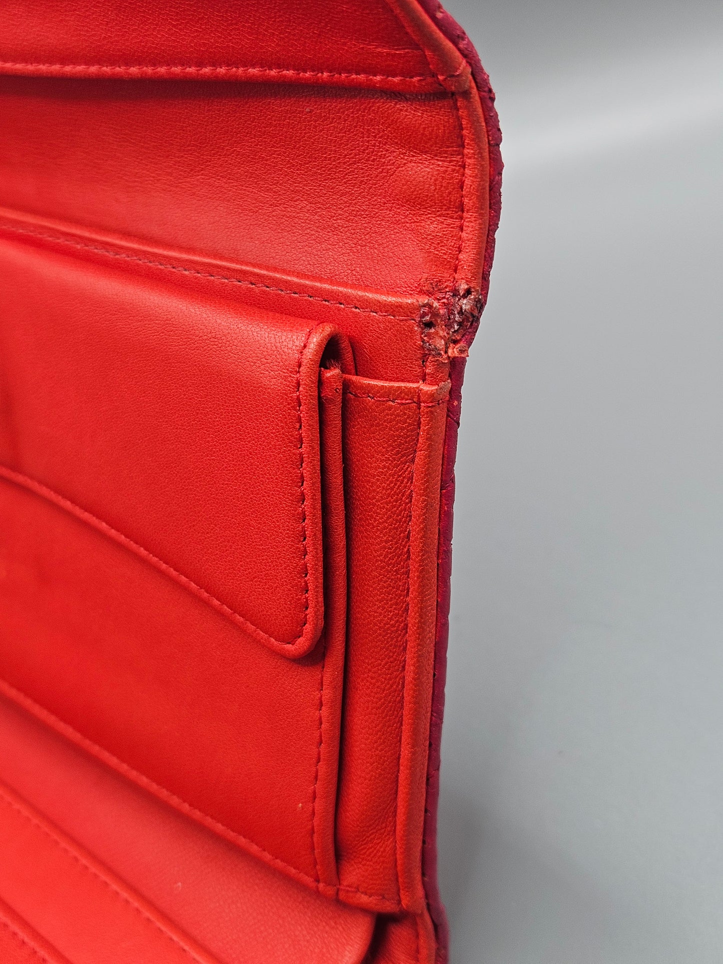 CHANEL Quilted Perforated Leather Wallet in Coral Red