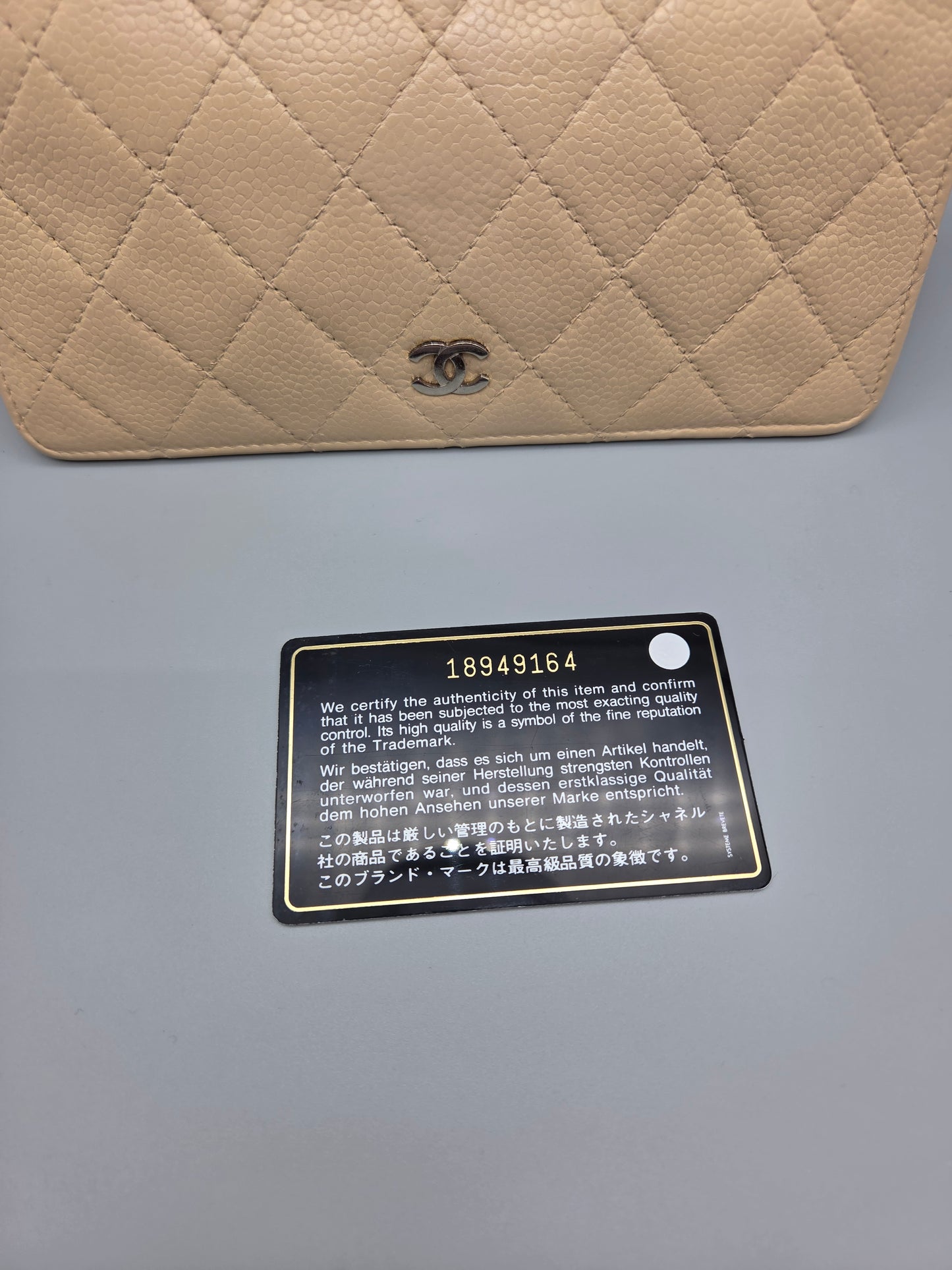 CHANEL Beige Quilted Leather Yen Wallet in Tan