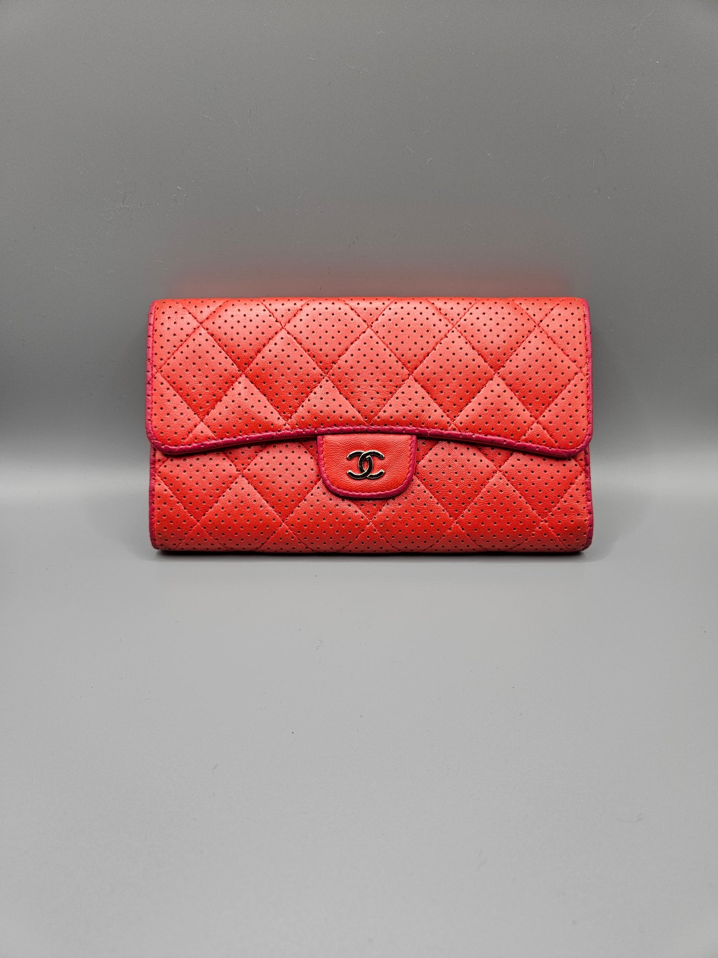 CHANEL Quilted Perforated Leather Wallet in Coral Red