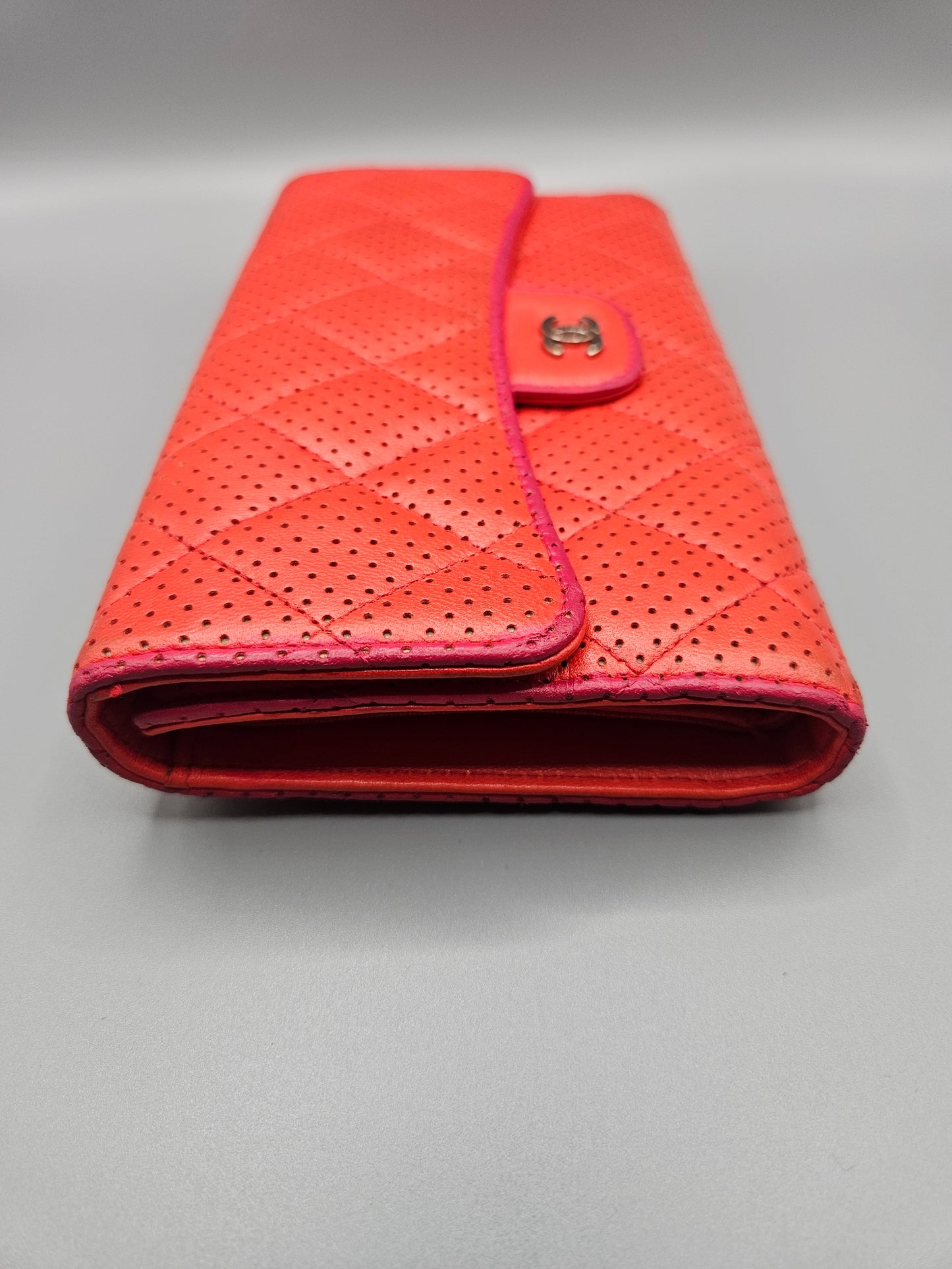 CHANEL Quilted Perforated Leather Wallet in Coral Red