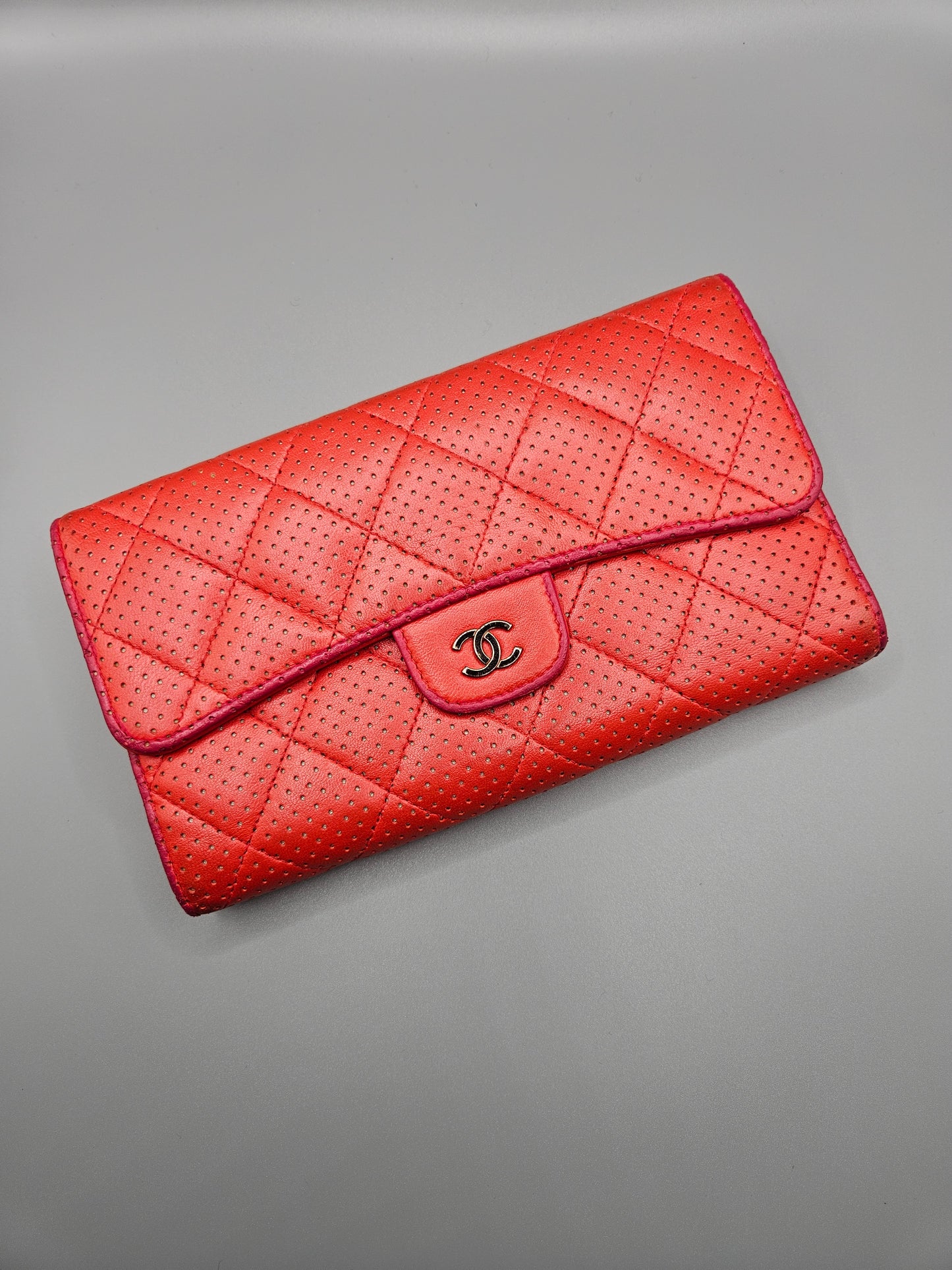 CHANEL Quilted Perforated Leather Wallet in Coral Red